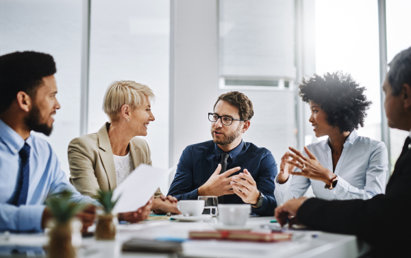 colleagues speaking around table